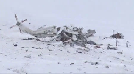 A medical emergency helicopter is seen after crashing in a mountainous area near Campofelice, central Italy January 24, 2017. èlive video news/Handout via REUTERS