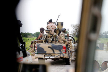 FILE PHOTO: A Nigerian army convoy vehicle drives ahead with an anti-aircraft gun, on its way to Bama, Borno State, Nigeria August 31, 2016. REUTERS/Afolabi Sotunde/File Photo