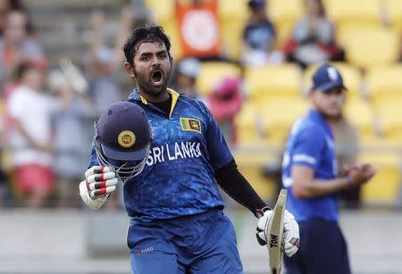 Sri Lanka's Lahiru Thirimanne celebrates reaching his century during their Cricket World Cup match against England in Wellington, March 1, 2015. REUTERS/Anthony Phelps