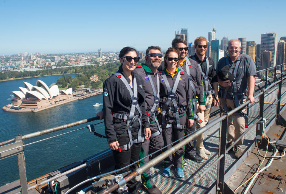 Prince Harry with Invictus representatives scaled the Harbour Bridge on Friday to raise the Invictus flag. Source: Getty