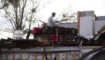 <p>People collect personal effects from damaged homes following a tornado in Dunrobin, Ontario west of Ottawa on Friday, Sept. 21, 2018. A tornado damaged cars in Gatineau, Que., and houses in a community west of Ottawa on Friday afternoon as much of southern Ontario saw severe thunderstorms and high wind gusts, Environment Canada said. (Photo from Sean Kilpatrick/The Canadian Press) </p>