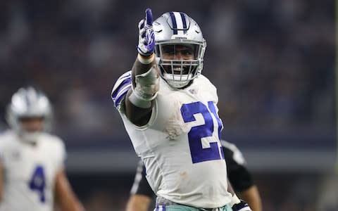 Dallas Cowboys running back Ezekiel Elliott (21) signals first down after a run in the fourth quarter against the New York Giants - Credit: Matthew Emmons/USA Today