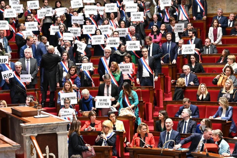 French prime minister Elisabeth Borne (bottom right) talks to labour minister Olivier Dussopt during the parliamentary protest (AFP via Getty Images)