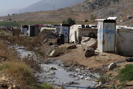 Toilets donated by Unicef and World Vision stand near tents at a Syrian refugee settlement camp in Qab Elias in the Bekaa Valley, near Baalbek, Lebanon October 17, 2015. REUTERS/Jamal Saidi