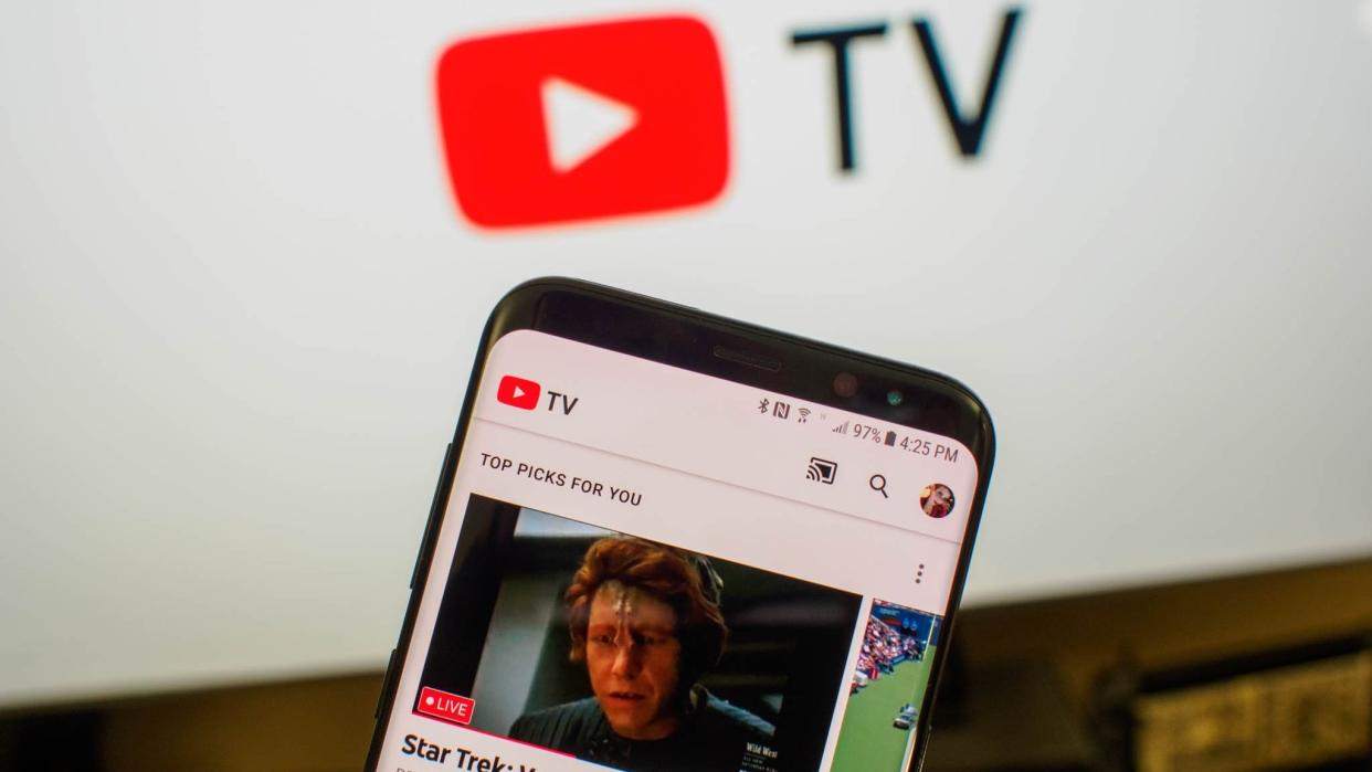  YouTube TV home page with TV screen in background. 