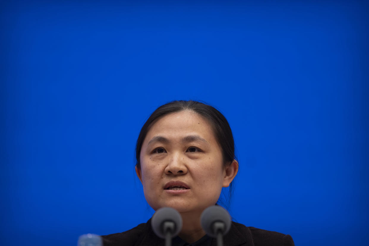 Zhou Lei, a researcher at the Chinese Center for Disease Control and Prevention, speaks at a press conference on the origins of COVID-19 at the State Council Information Office in Beijing, Saturday, April 8, 2023. (AP Photo/Mark Schiefelbein)