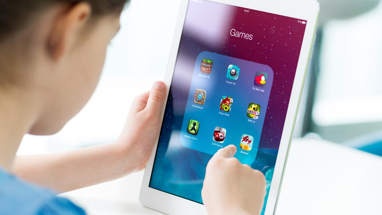  A child using an iPad mini. 