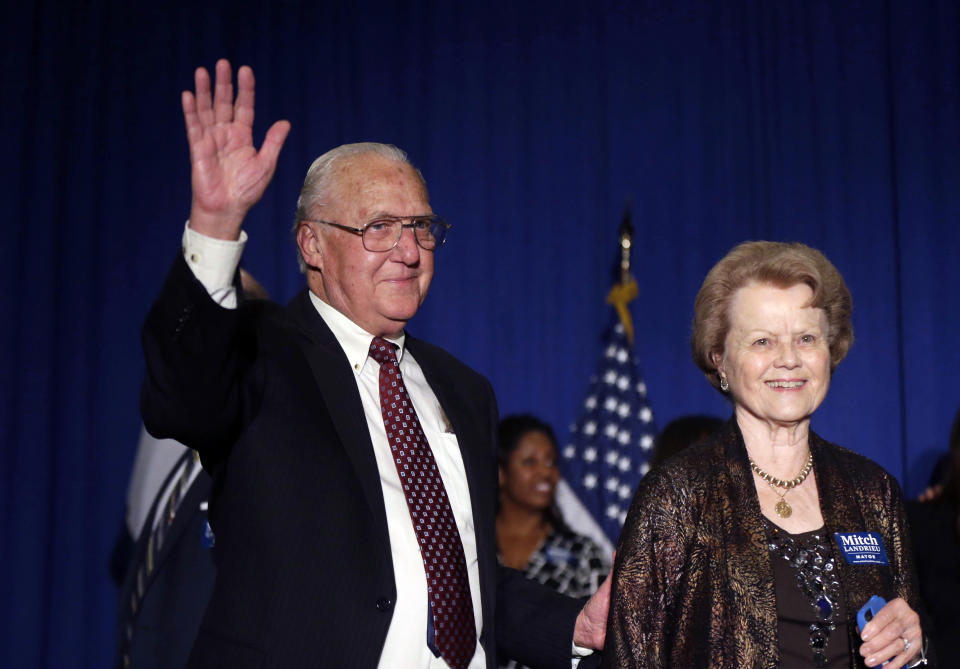 FILE - Former New Orleans Mayor Moon Landrieu waves with his wife Verna before his son, incumbent New Orleans Mayor Mitch Landrieu, arrives to address supporters after winning reelection in New Orleans, Saturday, Feb. 1, 2014. Moon Landrieu, the patriarch of a Louisiana political family who was a lonely voice for civil rights until the tide turned in the 1960s, has died at age 92. A family friend said Landrieu died Monday, Sept. 5, 2022. (AP Photo/Gerald Herbert, File)