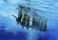 Canada's team are seen underwater as they perform in the synchronized swimming teams technical routine competition during the London 2012 Olympic Games at the Aquatics Centre August 9, 2012.