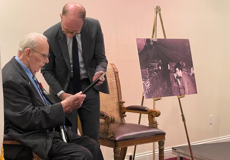 Yannick Tagand, Consul General of France to the Midwest, right, presents a Legion of Honor certificate to World War II veteran and newly knighted Chevalier Dean Preston, 98, of Pekin.