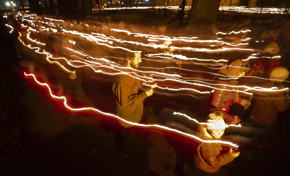 Orthodox believers walk with candles 