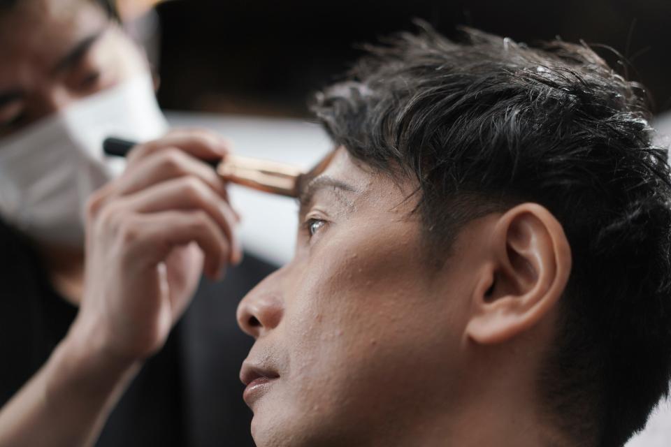 <p>A man gets his make-up done at a salon in Tokyo.  Businessmen have been visiting them in increasing numbers during the pandemic</p> (AP)