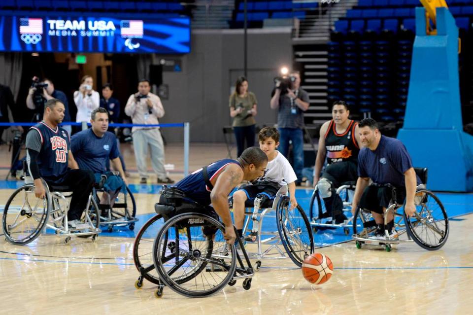 Team USA wheelchair basketball player Trevon Jenifer (center) participates in a sport demonstration during the 2016 Team USA Media Summit at Pauley Pavilion. Jenifer remains a key player for Team USA as it ramps up for the 2024 Paris Paralympics.