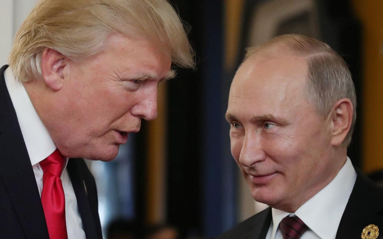 Donald Trump talks to Vladimir Putin - Mikhail Klimentyev/Sputnik/AFP via Getty Images