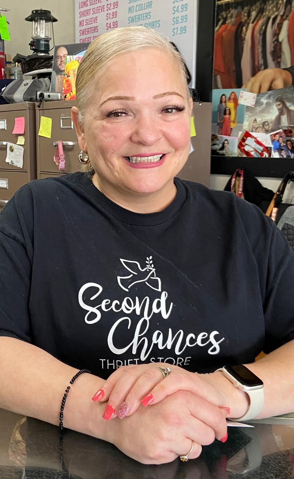 Delisa Jones, owner and founder of Second Chances Thrift Store ministry, stands at the counter of the ministry's Oklahoma City store at 2605 N MacArthur Blvd.