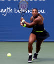 <p>Serena Williams hits a return against Arantxa Rus of the Netherlands during their second round match in the Western and Southern Open in N.Y.C. on Monday. </p>