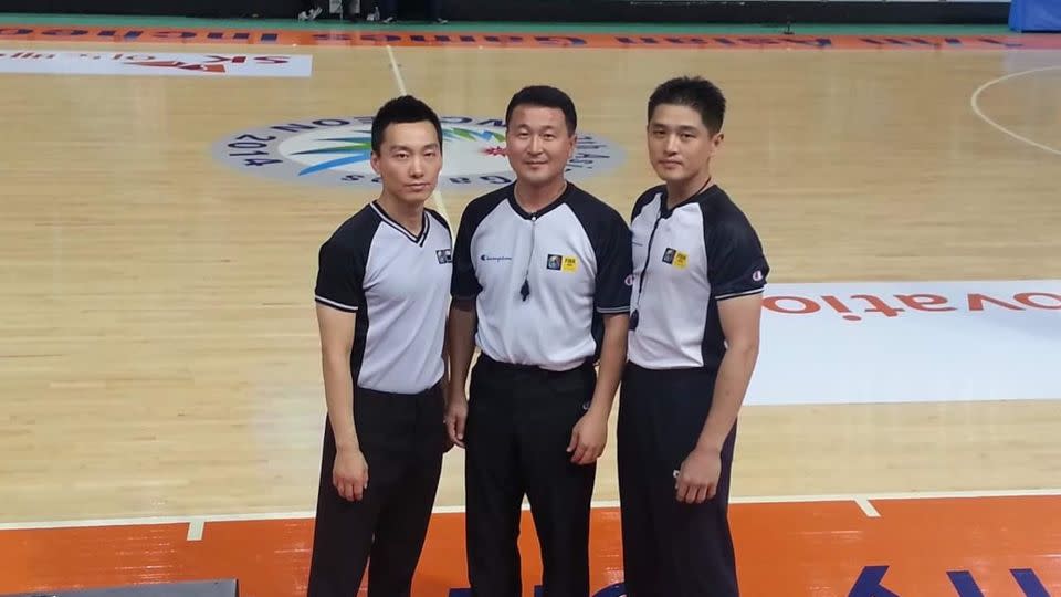 Hwang (right) and Shin (middle) before a game at the 2014 Incheon Asian Games with fellow FIBA referee Kim Cheong-soo (left). - Courtesy Shin Gi-rok