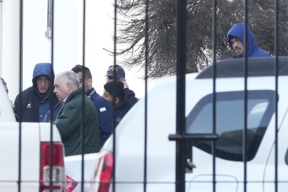 Police escort French rugby players Oscar Jegou, left, and Hugo Auradou, right, in Buenos Aires, Argentina, Thursday, July 11, 2024. The players were arrested following a formal complaint filed against them for alleged sexual assault, after France played Argentina in a test rugby match in Mendoza on July 6. (AP Photo/Natacha Pisarenko)