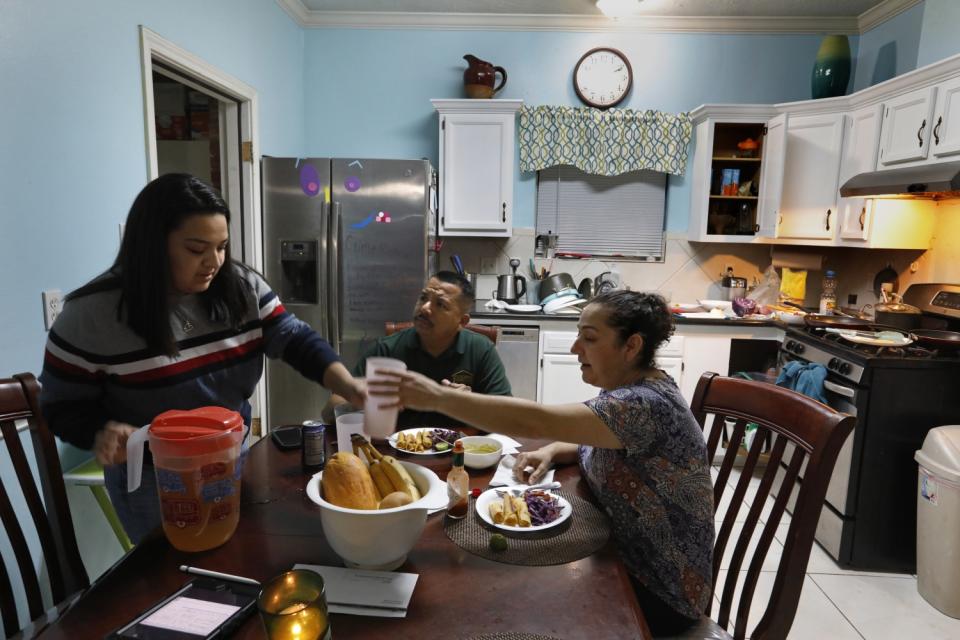 Flor Treviño makes dinner after work for husband Jose and daughter Stacy, 17.