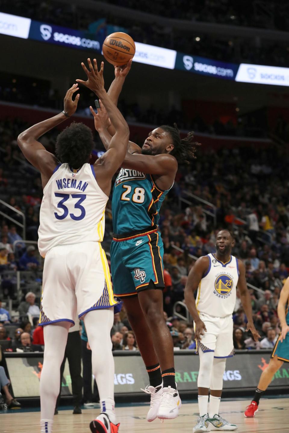 Pistons center Isaiah Stewart shoots against Warriors center James Wiseman during the first quarter Sunday, Oct. 30, 2022, at Little Caesars Arena.