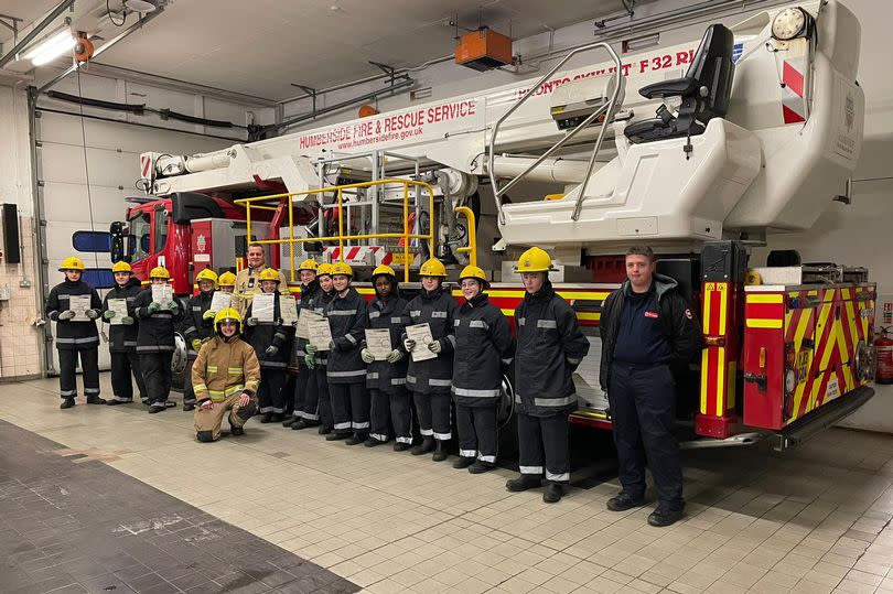 Mary Anna Jennings (in yellow) with the cadets at Humberside Fire and Rescue Peaks Lane Fire Station