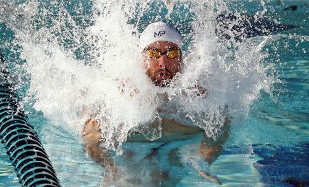 Apr 16, 2015; Mesa, AZ, USA; Michael Phelps jumps into the practice pool as he prepares for the Men's 100 meter butterfly final during the 2015 Arena Pro Swim Series at the Skyline Aquatic Center. Mandatory Credit: Rob Schumacher/Arizona Republic via USA TODAY Sports