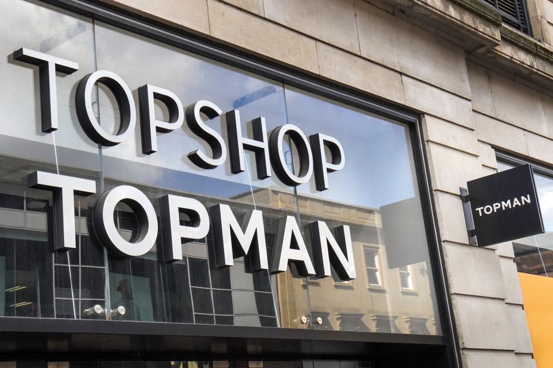 Store frontage showing copyright name and logo for Topshop and Topman