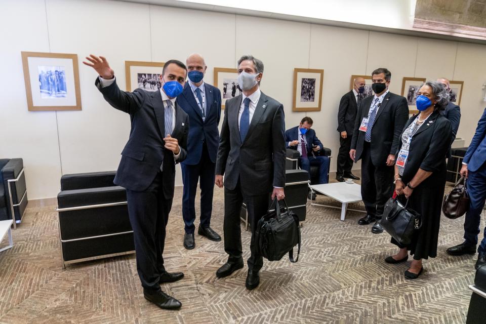 U.S. Secretary of State Antony Blinken, center, speaks with Italy's Foreign Minister Luigi Di Maio, left, as he arrives at a G20 foreign ministers meeting in Matera, Italy, Tuesday, June 29, 2021. Blinken is on a week long trip in Europe traveling to Germany, France and Italy. (AP Photo/Andrew Harnik, Pool)