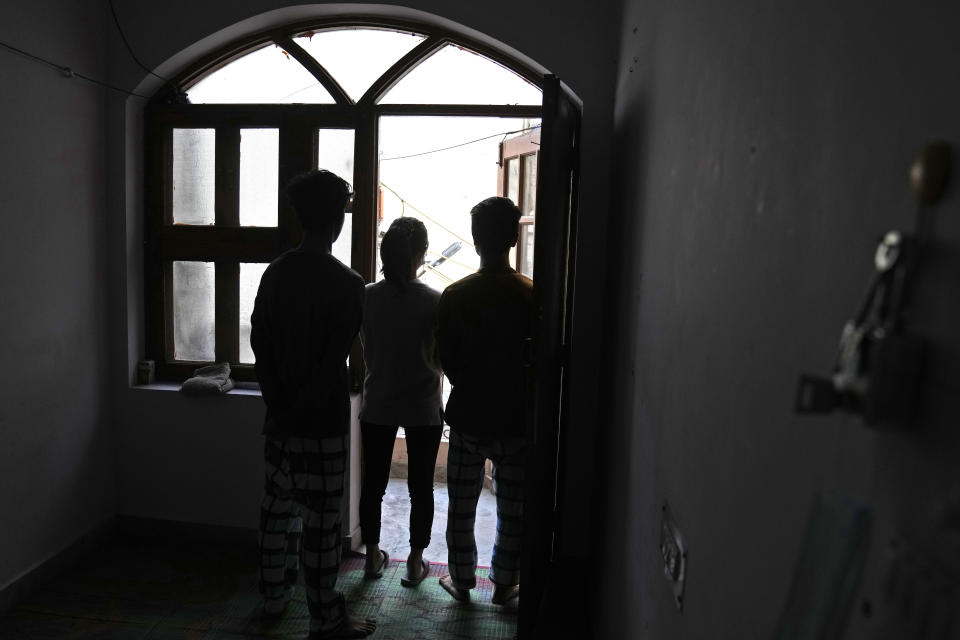 A Myanmar refugee, 21, who fled with her two younger brothers during the violence in the town of Matupi in Chin state in northwestern Myanmar, narrates her ordeal to the Associated Press at an undisclosed location, in India, Monday, Dec. 13, 2021. (AP Photo/Manish Swarup)