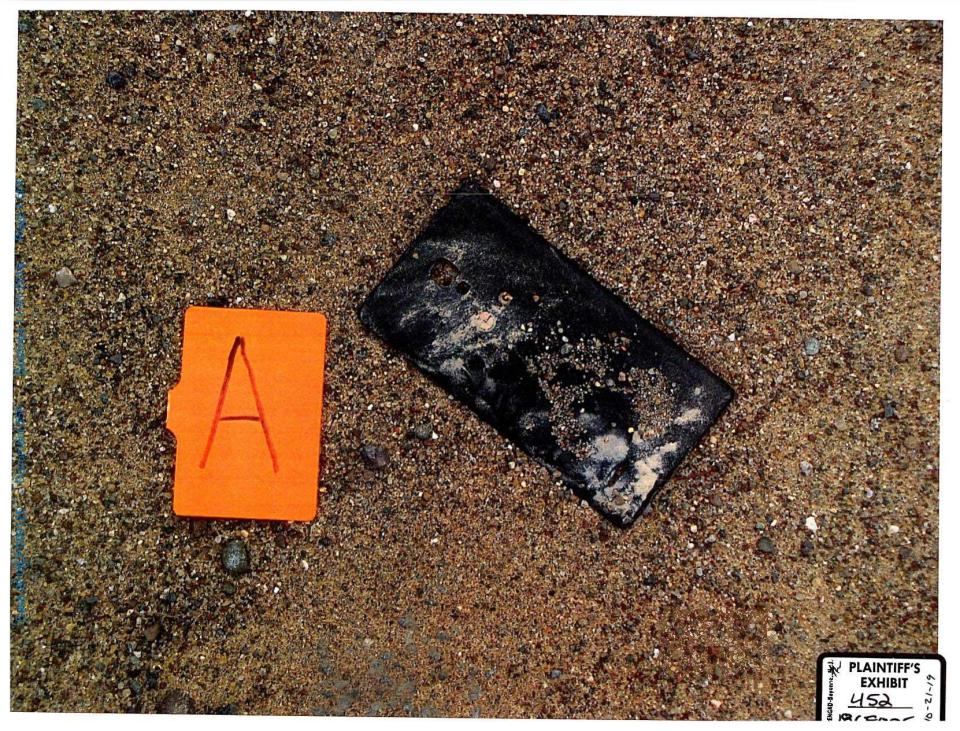 Investigators found Alex Woodworth's phone, which had been smashed along the dirt road. They believe Ezra McCandless took the phone to prevent Woodworth from calling for help. / Credit: Dunn County District Attorney's Office