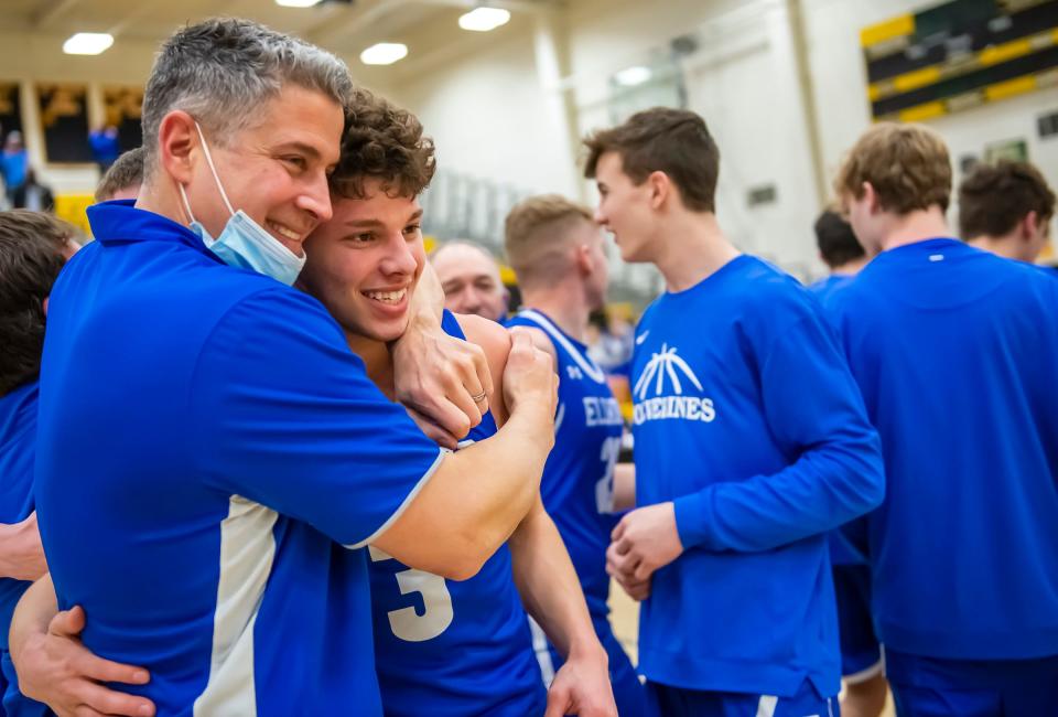 Ellwood City head coach Steve Antuono hugs his son Steve Jr. after the Wolverines beat South Allegheny in the 2021 WPIAL 3A championship.