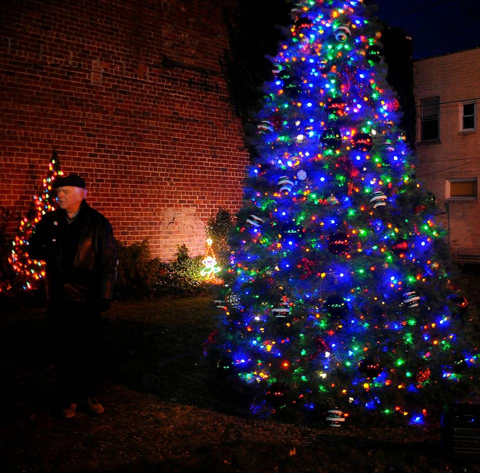 Sebring Mayor James Harp speaks to visitors during the annual tree lighting ceremony in downtown Sebring Village on Saturday, Dec. 3, 2022.