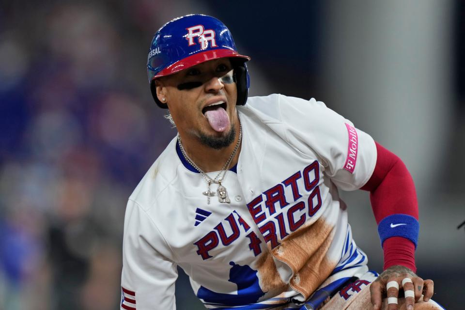 Puerto Rico's Javier Baez celebrates after stealing third base during the first inning of a World Baseball Classic game against Israel on Monday, March 13, 2023, in Miami.