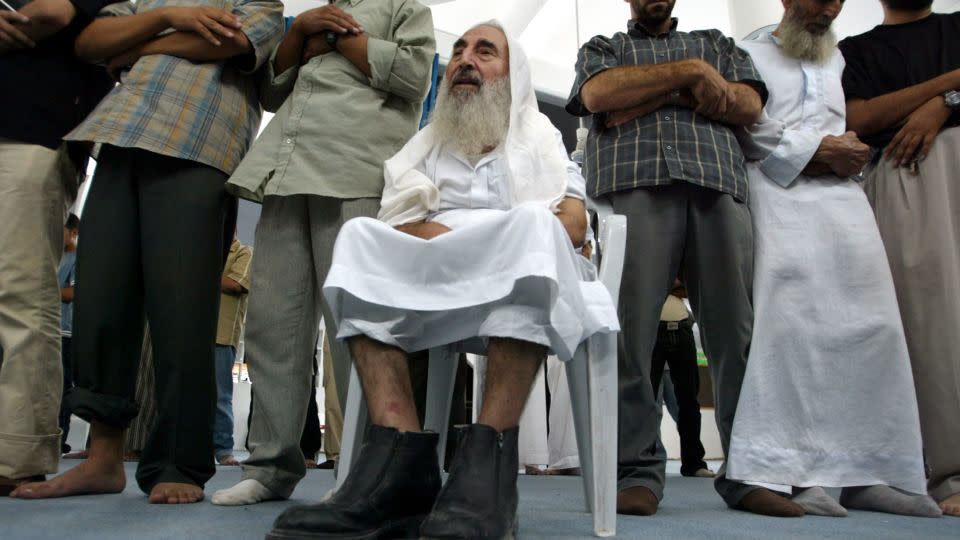 Sheikh Ahmed Yassin, the spiritual leader of the Islamic militant movement Hamas, prays in Gaza City September 6, 2003. - Eric Gaillard/Reuters