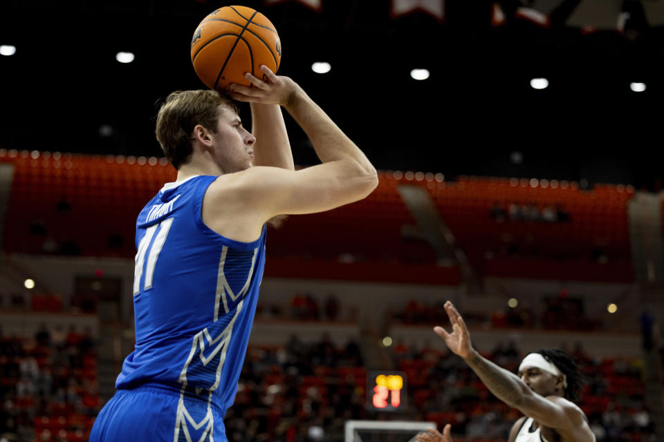 Creighton center Ryan Kalkbrenner (11) shoots a three point shot in the first half of an NCAA college basketball game against Oklahoma State, Thursday, Nov. 30, 2023, in Stillwater, Okla. (AP Photo/Mitch Alcala)