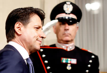 FILE PHOTO: Italian Prime Minister-designate Giuseppe Conte arrives to speaks with media at the Quirinal Palace in Rome, May 23, 2018. REUTERS/Alessandro Bianchi/File Photo