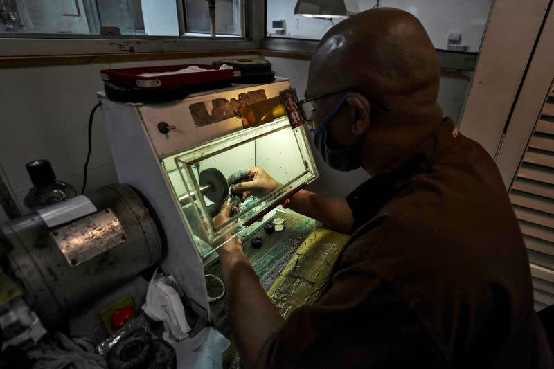 An employee works at a diamond jewellery manufacturing factory in Mumbai