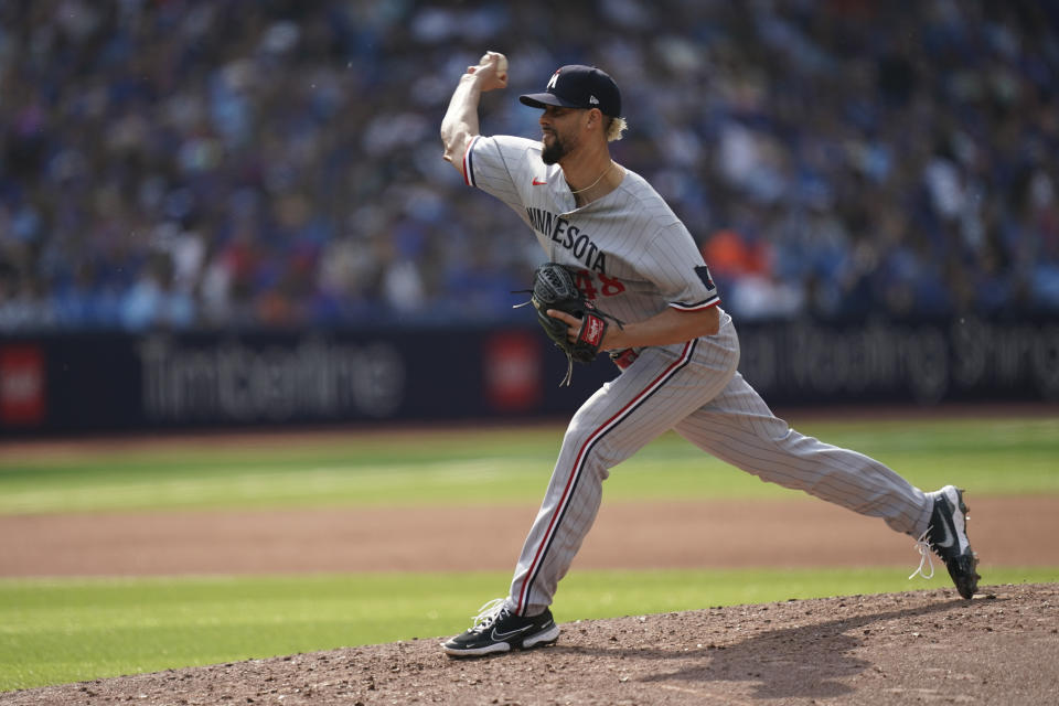 Minnesota Twins relief pitcher Jorge Lopez (48) throws against the Toronto Blue Jays during the seventh inning of a baseball game, Saturday, June 10, 2023, in Toronto. (Arlyn McAdorey/The Canadian Press via AP)