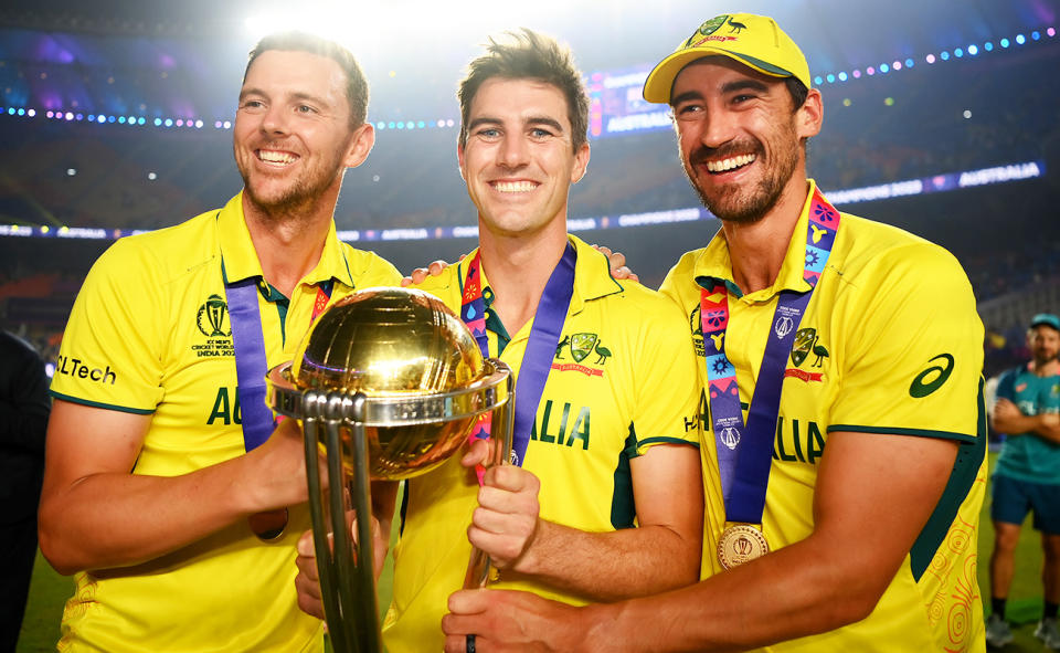 Josh Hazlewood, Pat Cummins and Mitchell Starc after Australia's triumph in the Cricket World Cup final.