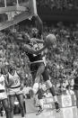 FILE - In this April 1, 1985, file photo, Villanova's Harold Pressley (21) goes up for a basket against Georgetown's Patrick Ewing in the NCAA college basketball Final Four championship game, in Lexington, Ky. Underdog Villanova, shooting 79 percent from the field, denied Patrick Ewing and top-ranked Georgetown a second straight NCAA basketball title Monday night with a 66-64 victory. (AP Photo/John Swart, File)