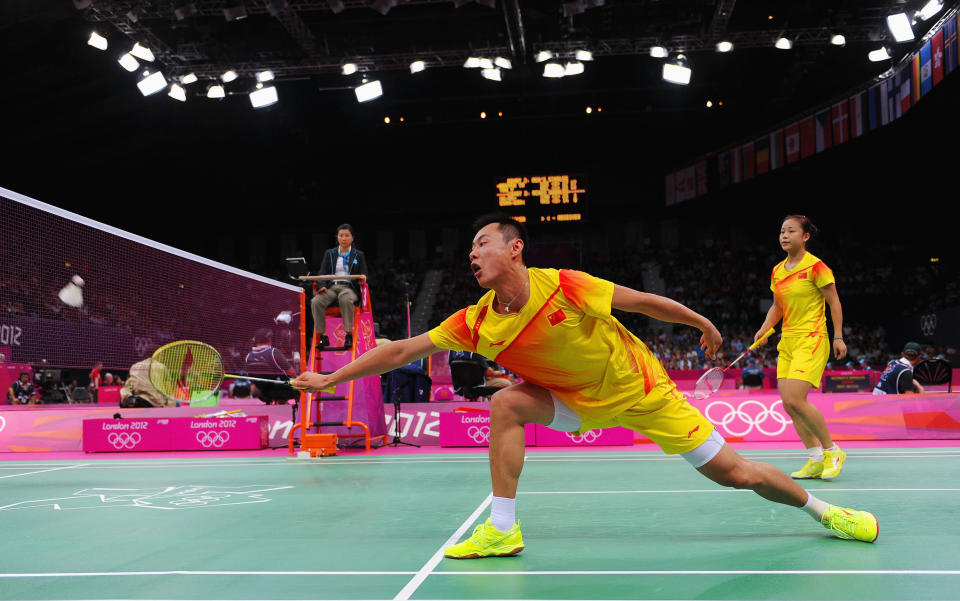 LONDON, ENGLAND - JULY 29: Chen Xu (L) and Jin Ma (R) of China return a shot against Peng Soon Chan and Liu Ying Gohon of Malaysia during their Mixed Doubles Badminton on Day 2 of the London 2012 Olympic Games at Wembley Arena on July 29, 2012 in London, England. (Photo by Michael Regan/Getty Images)