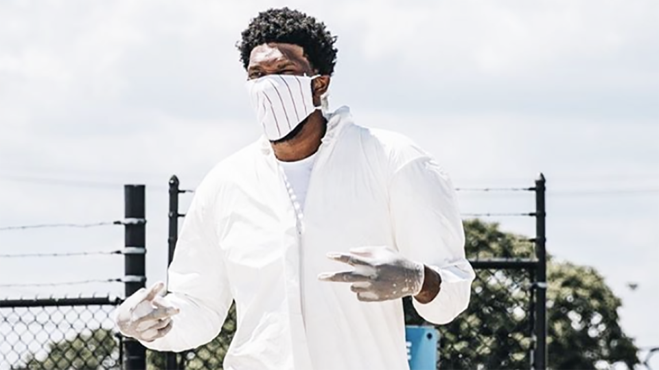 Philadelphia 76ers centre Joel Embiid is pictured arriving at his flight to the NBA 'bubble' wearing a full hazmat suit. Picture: Instagram/joelembiid