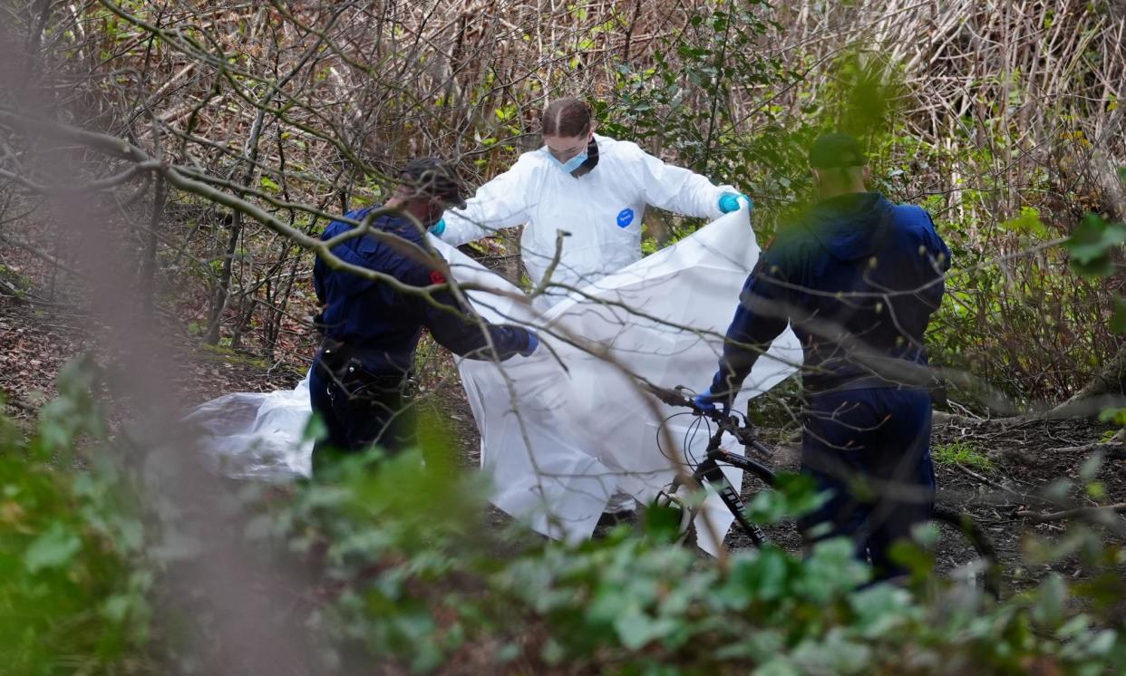 <span>Police and forensic officers at Kersal Dale, near Salford, on 5 April after the discovery of the torso.</span><span>Photograph: Peter Byrne/PA</span>