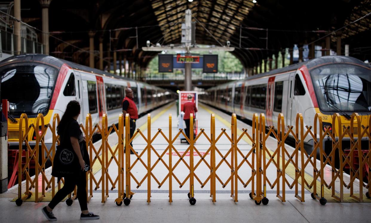 <span>A passenger walks past a closed platform at Liverpool Street station during a strike by the Aslef train drivers in September 2023. </span><span>Photograph: Tolga Akmen/EPA</span>