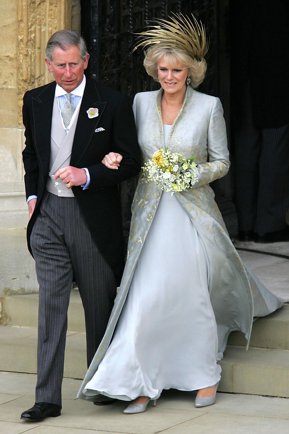 WINDSOR, ENGLAND - APRIL 9: (NO UK SALES FOR 28 DAYS) TRH Prince Charles, the Prince of Wales and his wife, Camilla, the Duchess Of Cornwall, leave the Service of Prayer and Dedication following their marriage at The Guildhall, at Windsor Castle on April 9, 2005 in Berkshire, England. (Photo by ROTA-Pool/Getty Images)