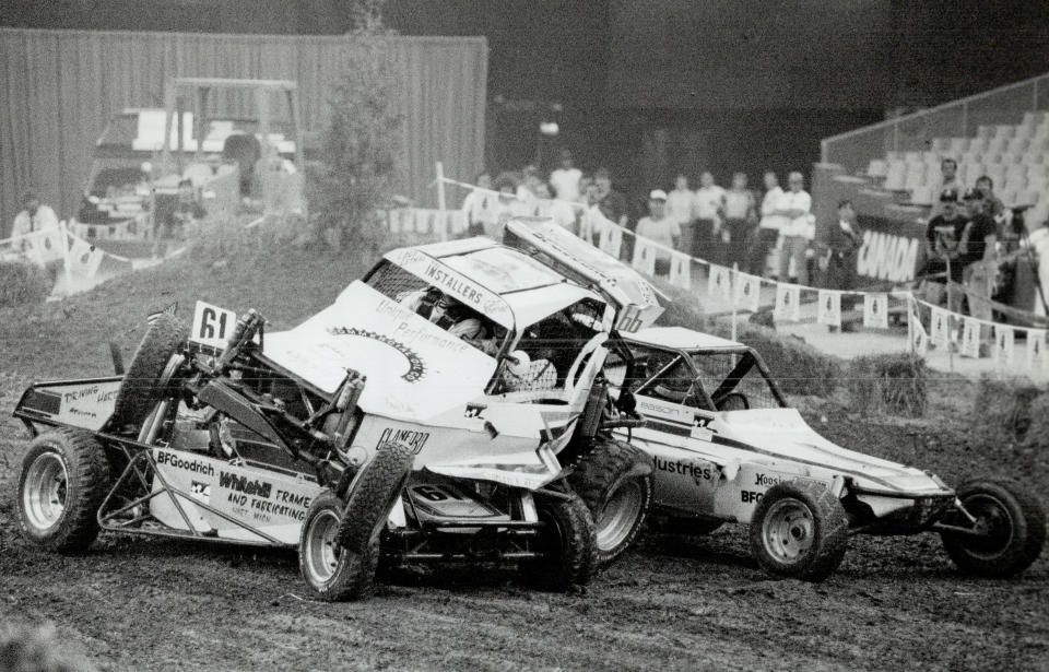 June 23, 1989: Dome pile-up: Ray Jennings of Hamilton gets squeezed by Kevin Norris of Michigan; racing in his Whitehill Bandit (No.61); and another vehicle during off-road car qualifying race in the Molson Supercross at SkyDome. (Photo by Boris Spremo/Toronto Star via Getty Images)