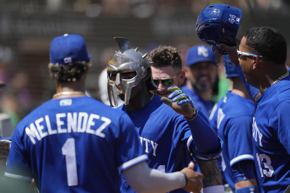 Kansas City Royals' Dairon Blanco, middle, is congratulated by teammates after hitting a home run during the third inning of a baseball game against the Oakland Athletics in Oakland, Calif., Wednesday, Aug. 23, 2023. (AP Photo/Jeff Chiu)