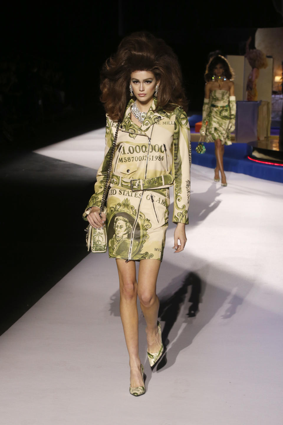 Model Kaia Gerber wears a creation as part of the Moschino women's Fall-Winter 2019-2020 collection, that was presented in Milan, Italy, Thursday, Feb.21, 2019. (AP Photo/Antonio Calanni)