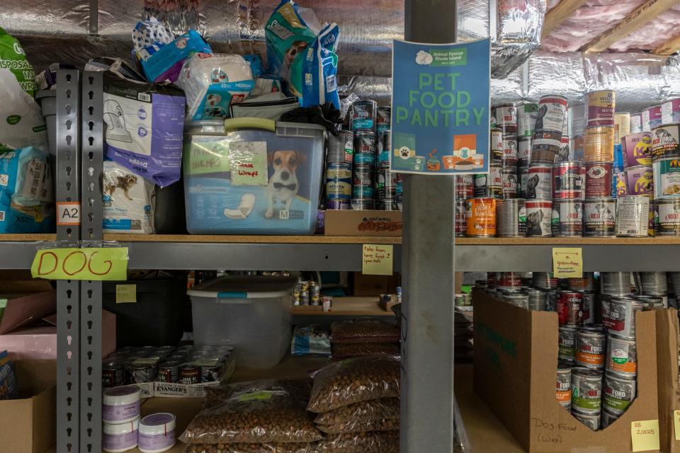 Food and pet products sit on shelves in the food pantry at Animal Rescue Rhode Island in South Kingstown.