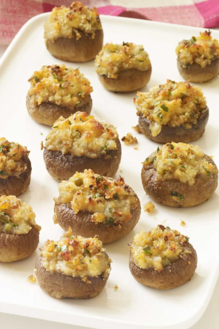 <p>These stuffed mushrooms pack big flavors into a tiny package.</p><p><a href="https://www.womansday.com/food-recipes/food-drinks/recipes/a11418/stuffed-mushrooms-recipe-wdy1113/" rel="nofollow noopener" target="_blank" data-ylk="slk:Get the Stuffed Mushrooms recipe." class="link rapid-noclick-resp"><em><strong>Get the Stuffed Mushrooms recipe.</strong></em></a></p>